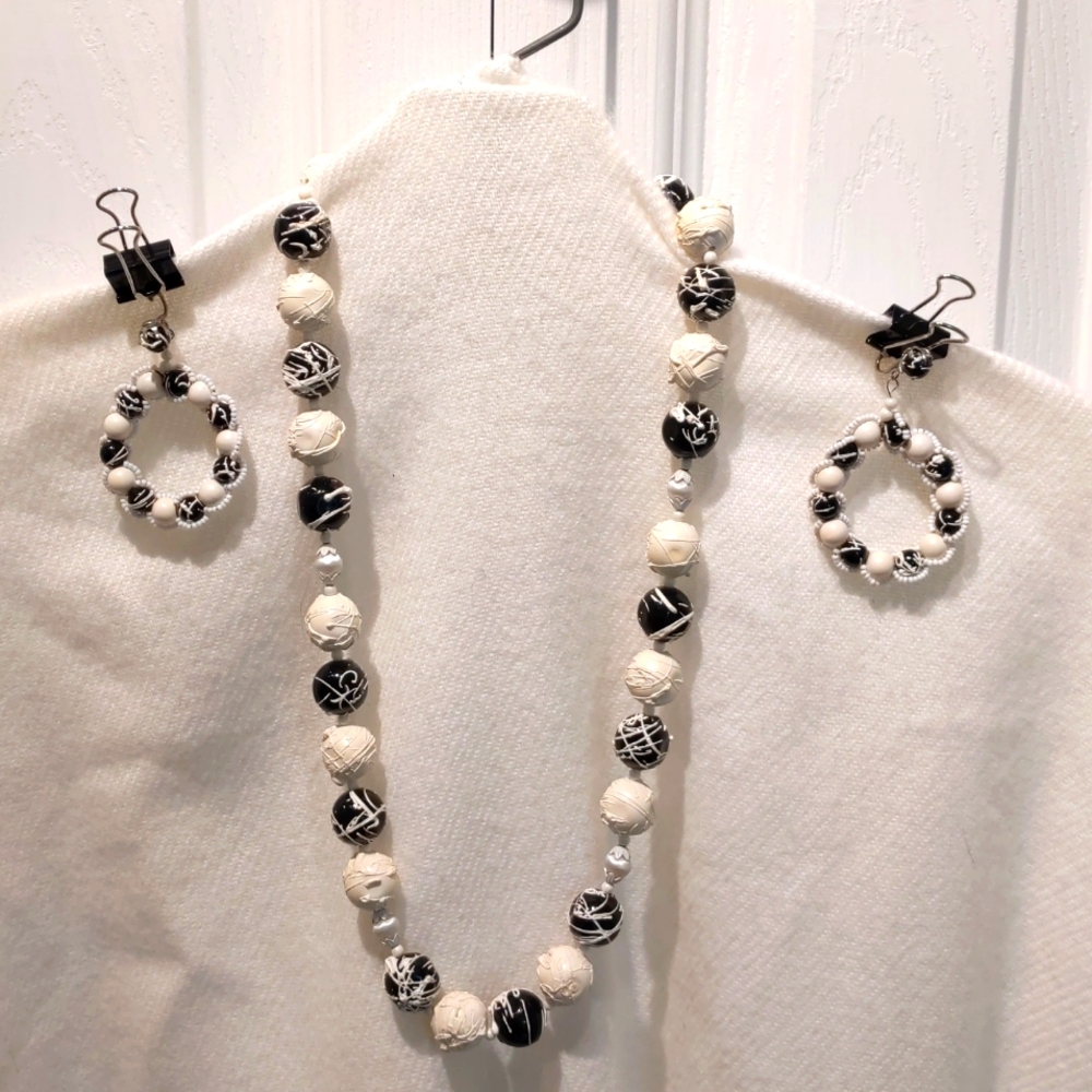 Vintage black and white beaded necklace set with matching clip-on earrings.
